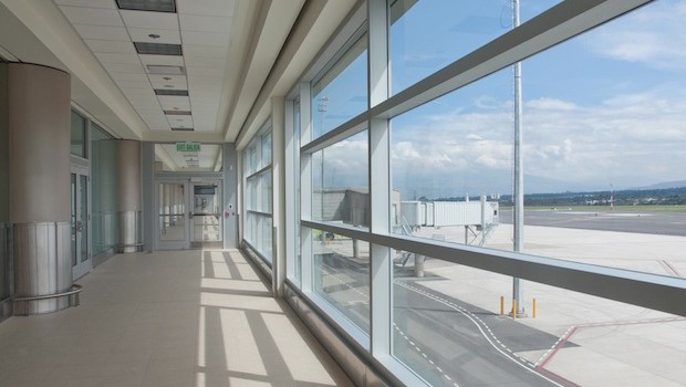 A passenger corridor with view of the tarmac, at the new Quito airport