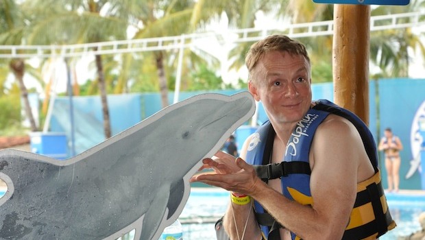 Demonstrating how to kiss a dolphin at Dolphin Discovery Vallarta.