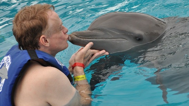Time for a kiss during the Royal Dolphin Swim at Dolphin Discovery Vallarta.