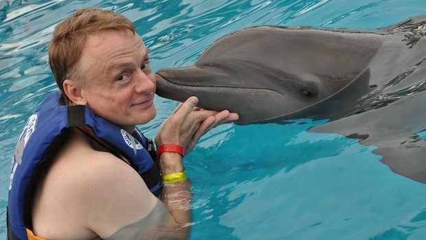 Getting a kiss back during the Royal Dolphin Swim at Dolphin Discovery Vallarta.