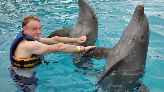 Handshakes during the Royal Dolphin Swim at Dolphin Discovery Vallarta.