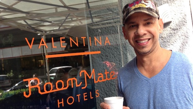 Angel enjoys a cup of coffee at the entrance to Room Mate Valentina hotel.