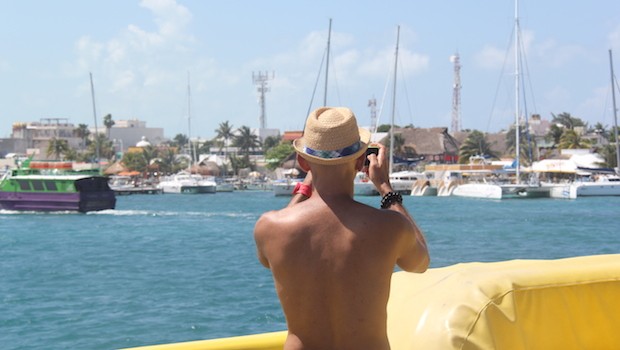 Angel photographs boats at the dock at Isla Mujeres, Mexico.