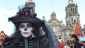 Traditional catrina garb at the first Mexico City Day of the Dead parade.