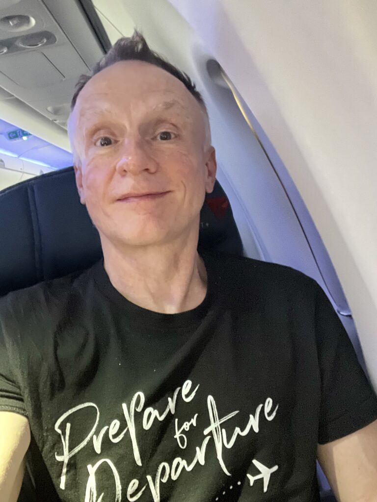 Airline passenger, frequent flyer and travel writer Mark Chesnut sits on a plane